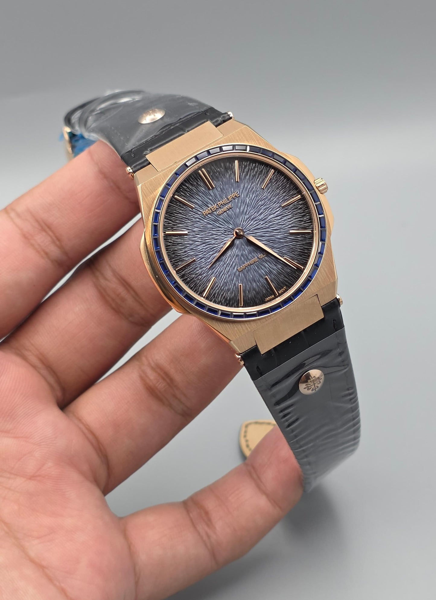 Gold-Tone Luxury Watch with Blue Stone-Set Bezel Textured Dial