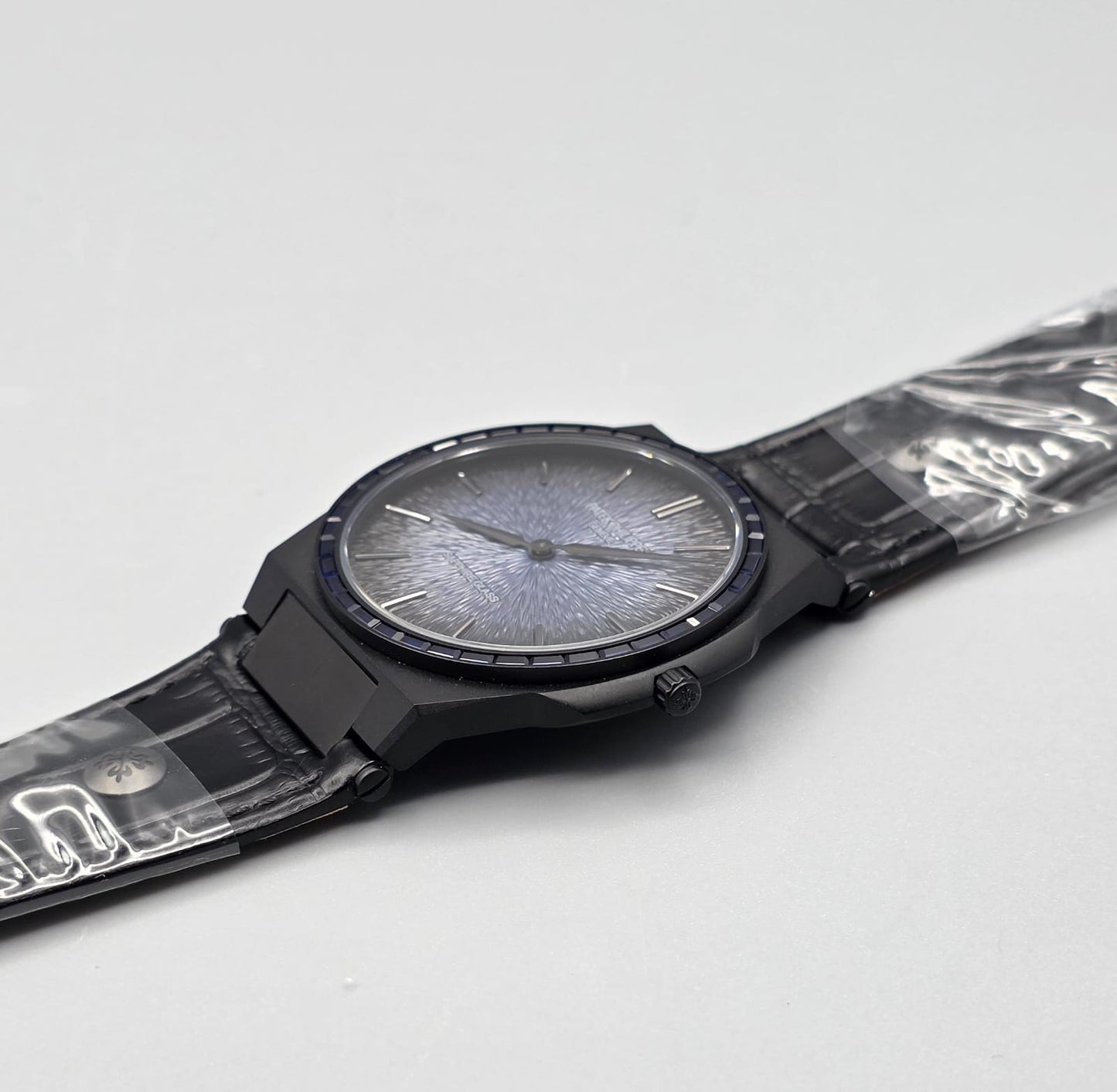 Black Luxury Watch with Blue Stone-Set Bezel & Textured Dial