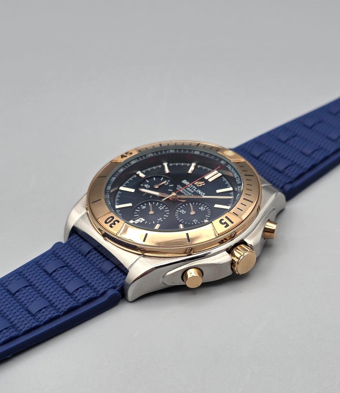 Luxury Chronograph Watch with Blue Dial, Gold-Tone Bezel & Blue Rubber Strap