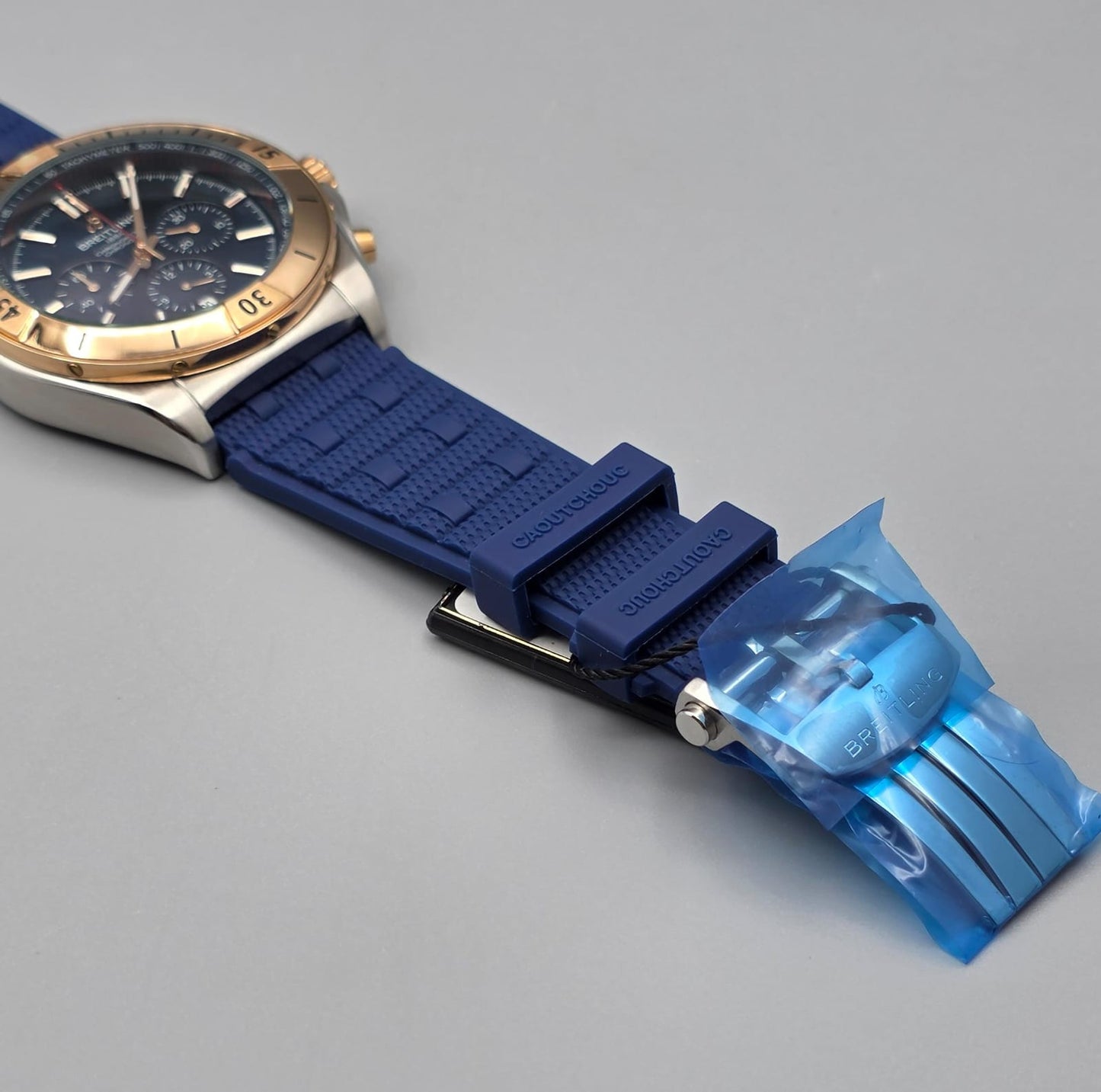 Luxury Chronograph Watch with Blue Dial, Gold-Tone Bezel & Blue Rubber Strap