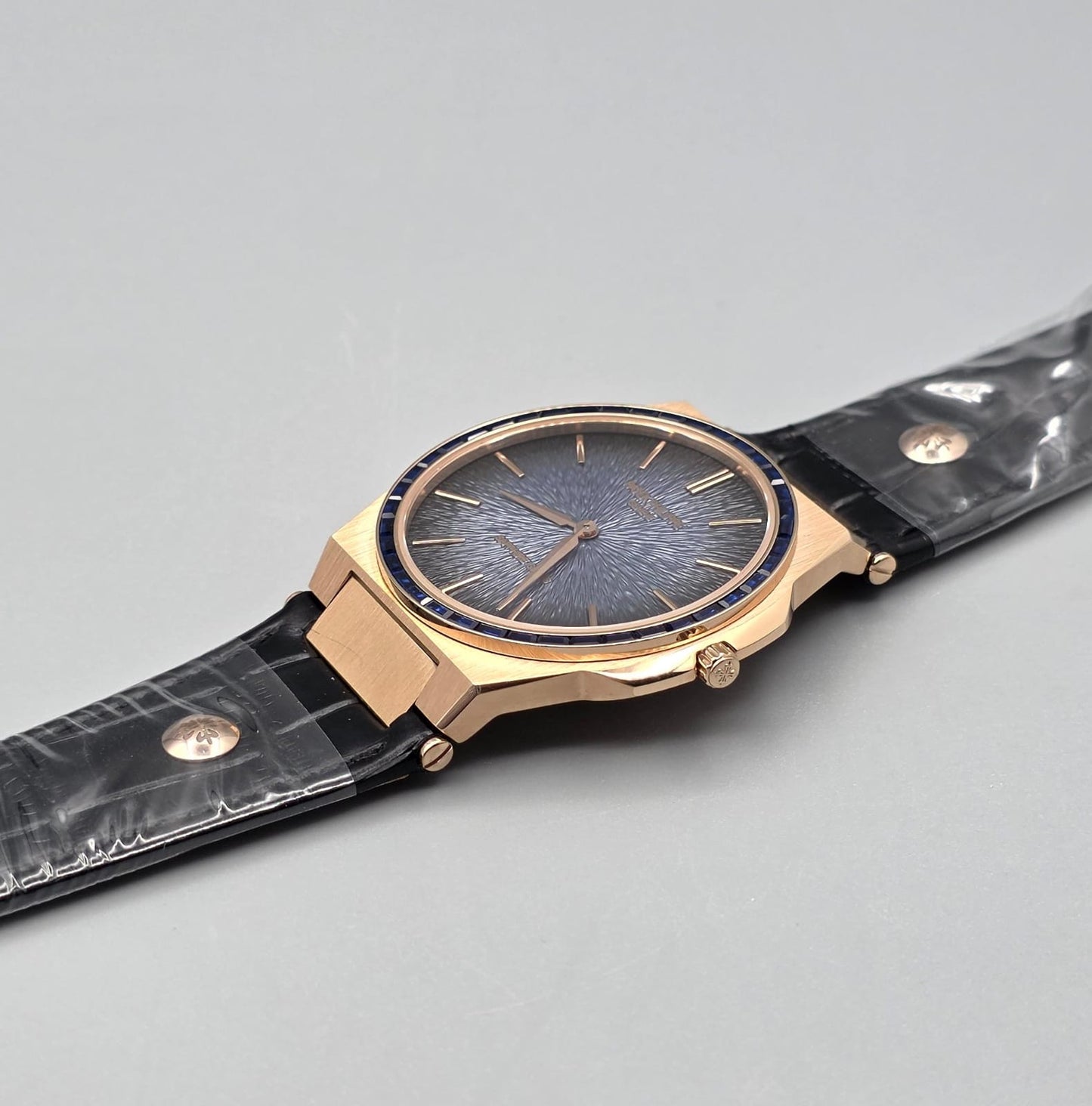 Gold-Tone Luxury Watch with Blue Stone-Set Bezel Textured Dial
