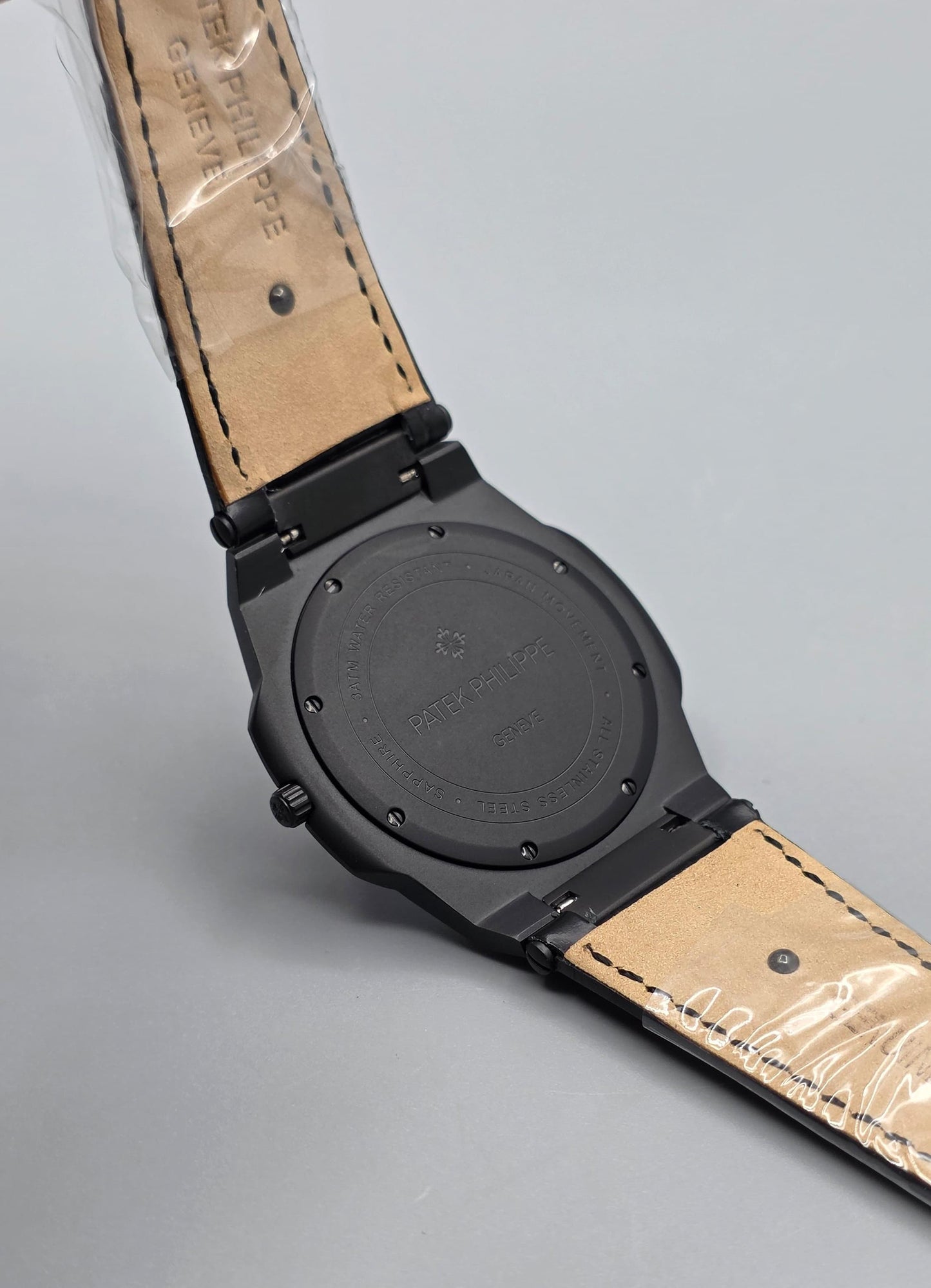 Black Luxury Watch with Blue Stone-Set Bezel & Textured Dial